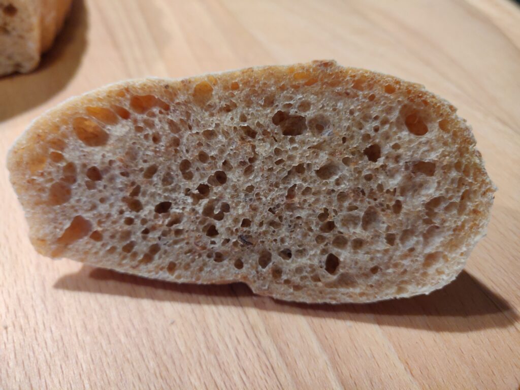 shows a piece of cut bread with nice crumb.